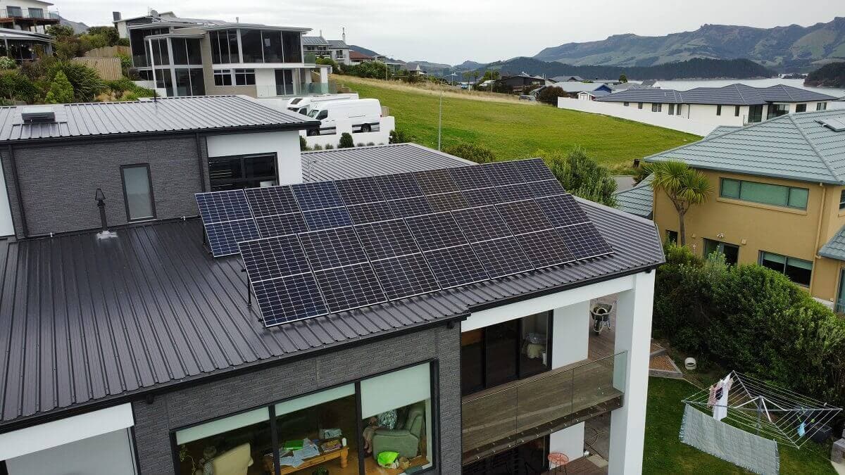 Solar panel array on a modern Canterbury home with mountain views