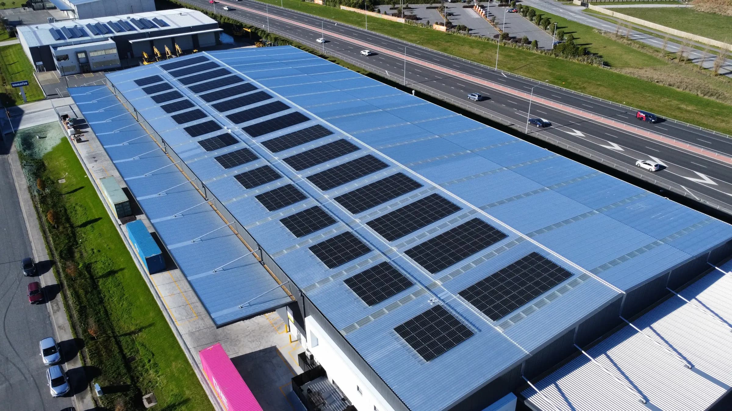 Aerial view of a large commercial rooftop solar array at Gallagher Drive in Christchurch