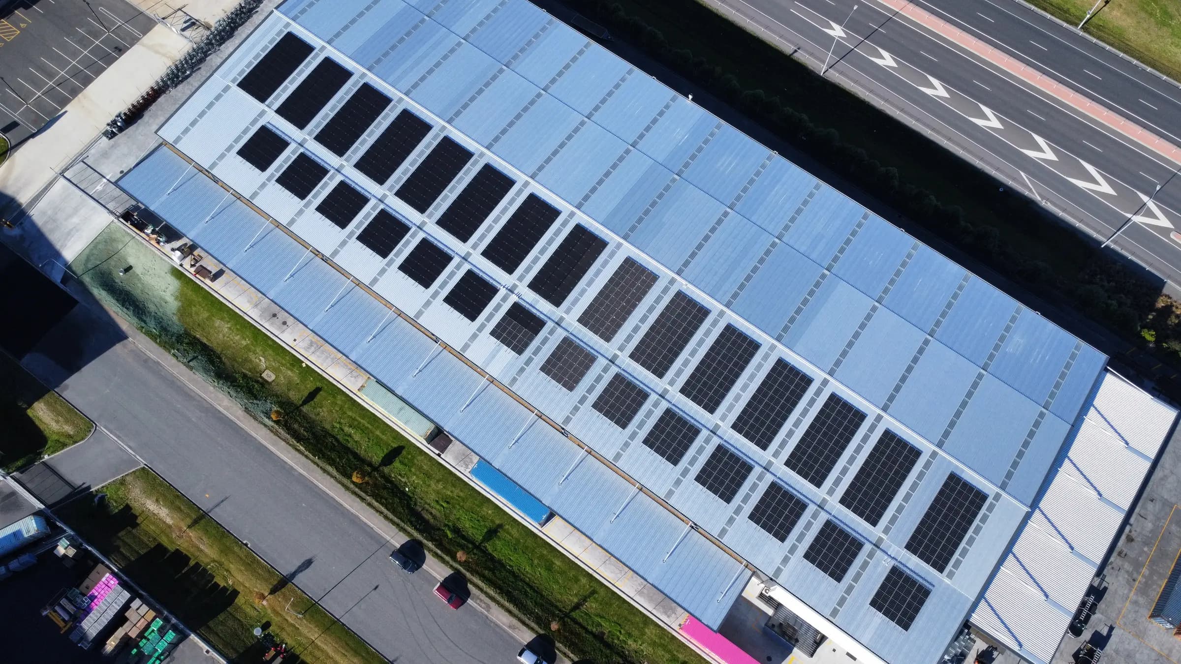 Top-down aerial view of an extensive commercial solar array on Gallagher Drive