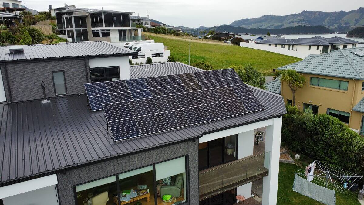 Solar panel array on a modern Canterbury home with mountain views